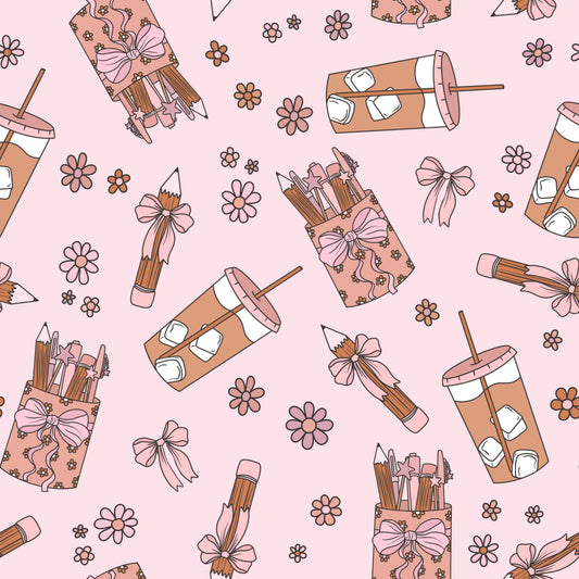 Pattern of pencils in pink cases with bows, iced coffee drinks, and flowers on a pink background.